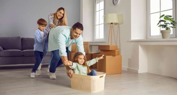 A young family moving into a new home in this image from Shutterstock