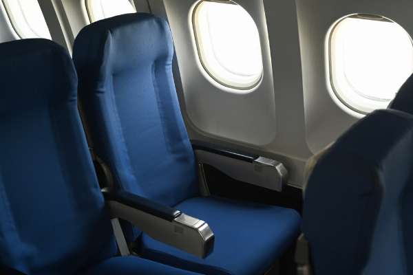 Blue window seat on an airplane