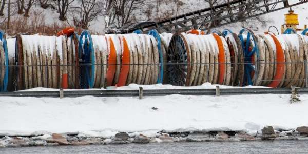 Colorful fiber-optic cables in the snow in this image from Shutterstock